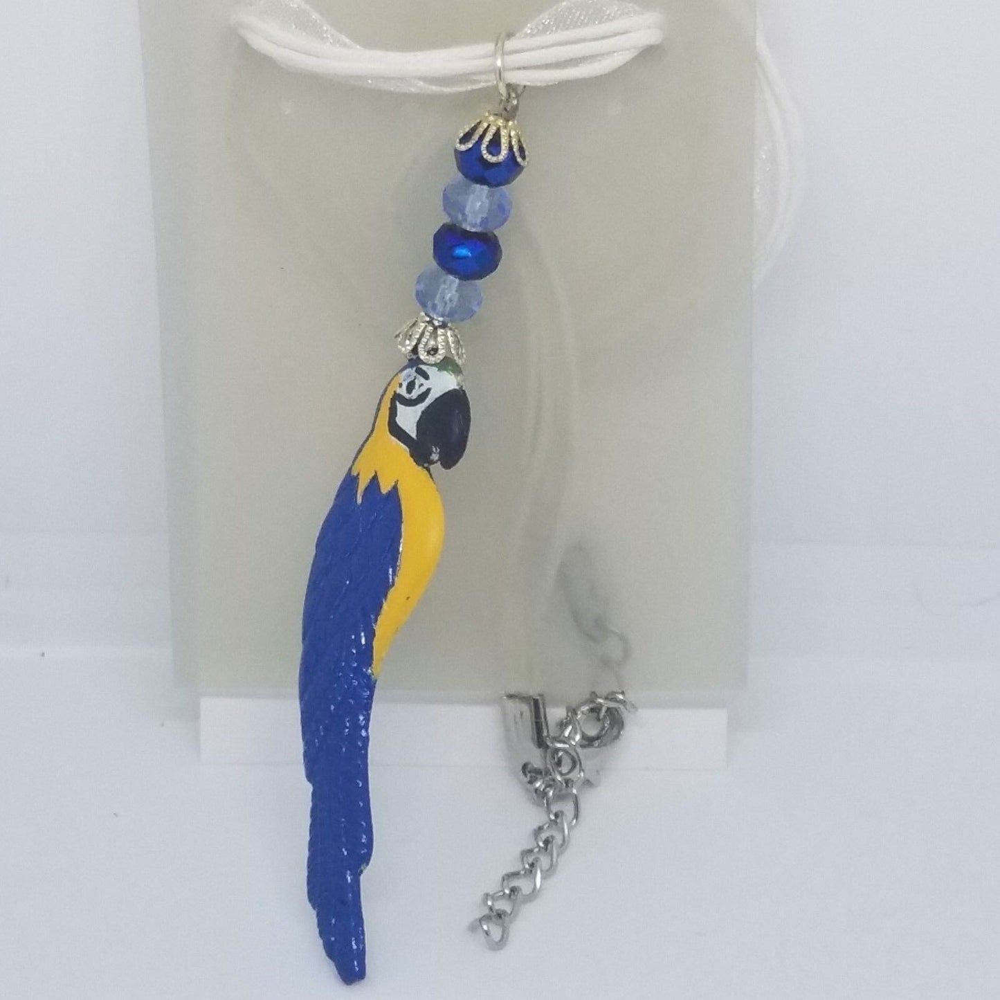 Necklace 2" Painted Blue Parrot Charm Blue Silver Beads White Ribbon Cord