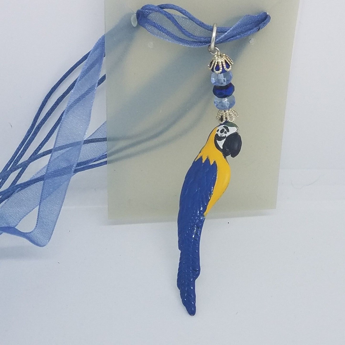 Necklace 2" Painted Blue Parrot Charm Blue Silver Beads Blue Ribbon Cord