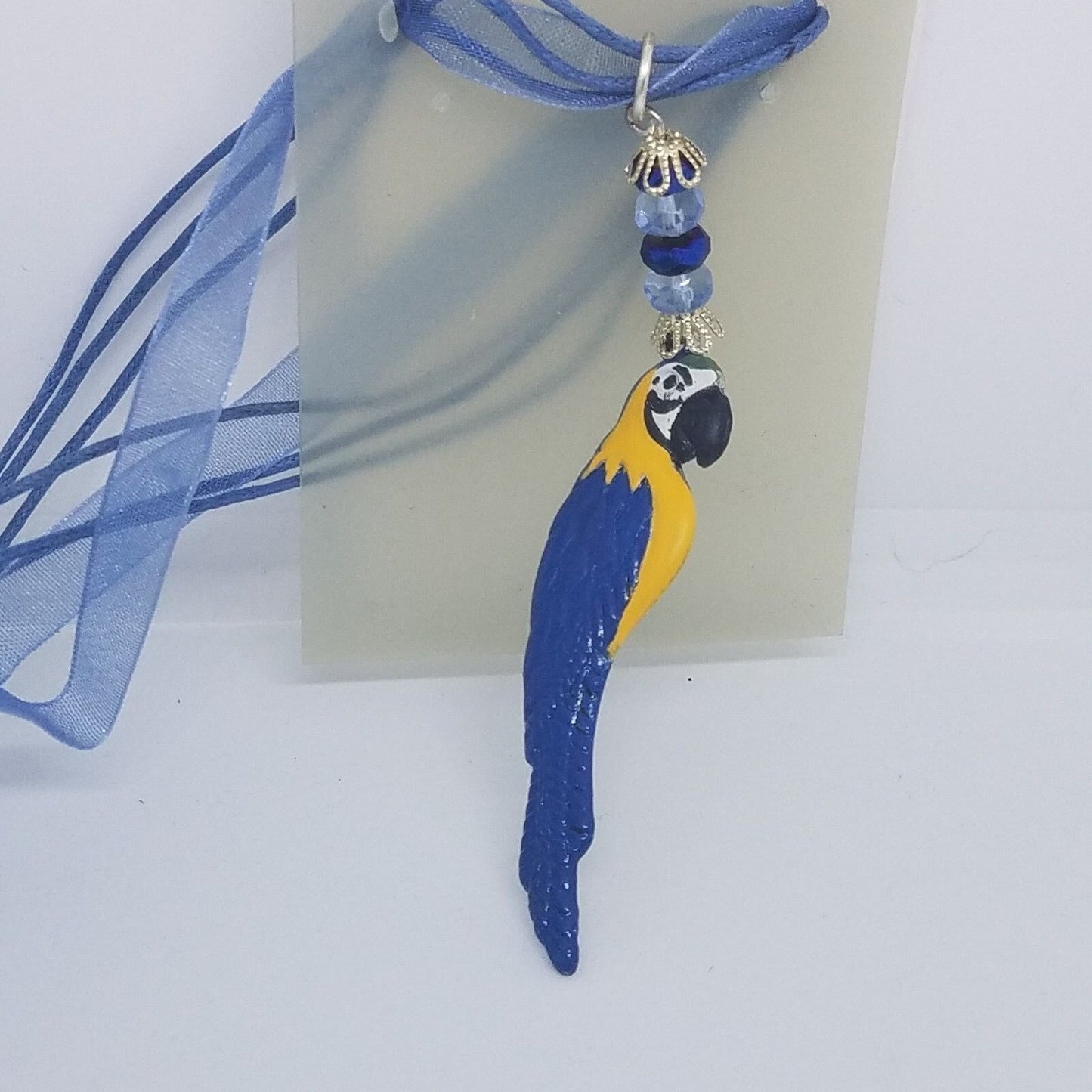 Necklace 2" Painted Blue Parrot Charm Blue Silver Beads Blue Ribbon Cord