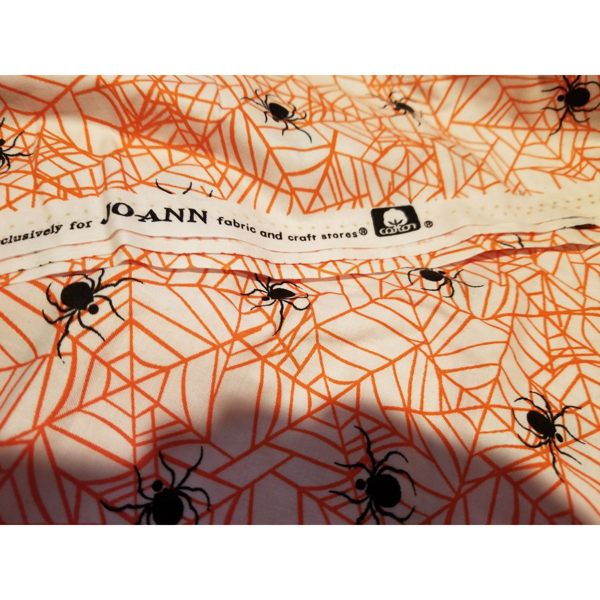 Material Cotton White Fabric Black Spiders  Orange Cobwebs 36" x  44" Cotton JoAnn