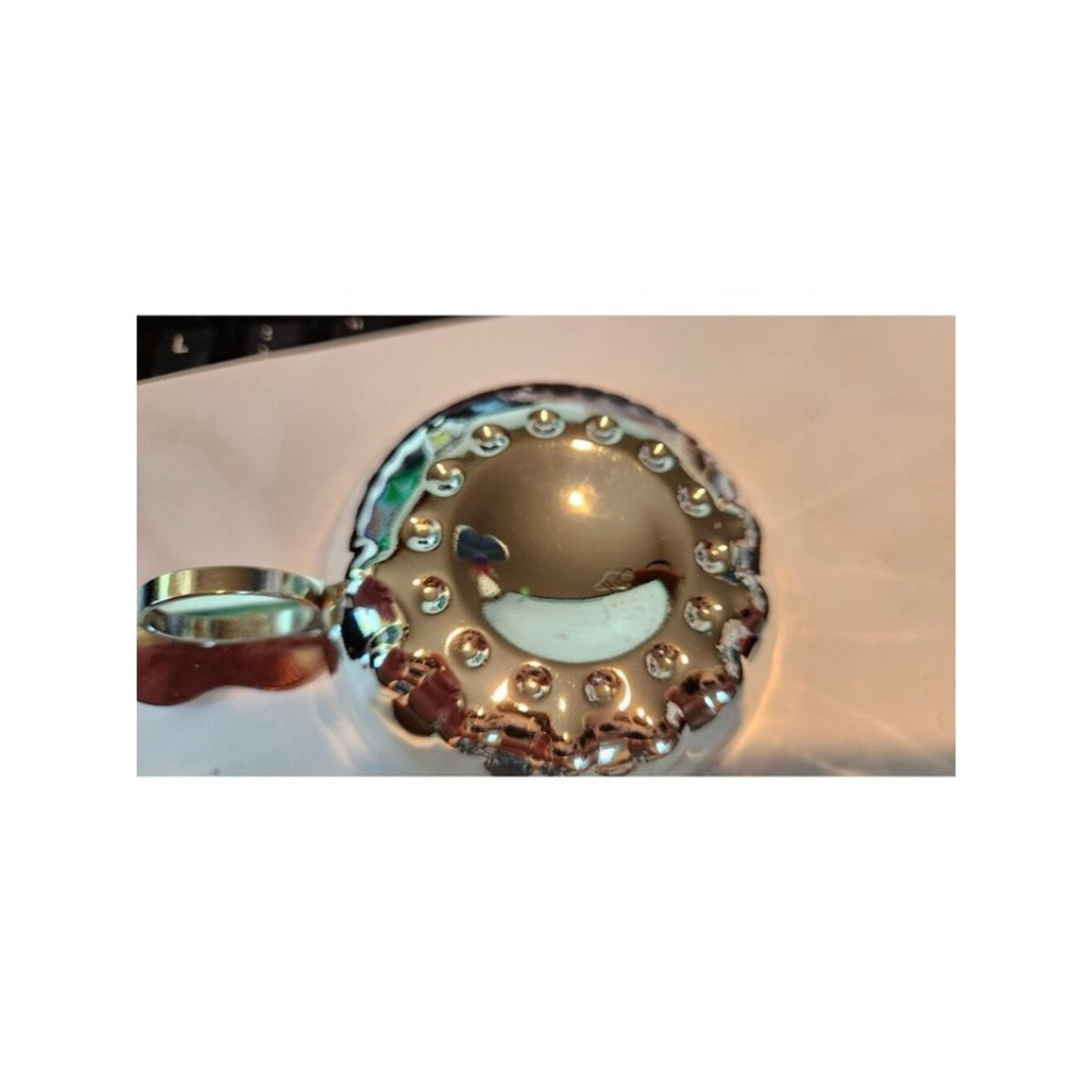 Sommeliers tasting cup A shallow, silver tastevin traditionally for winemakers