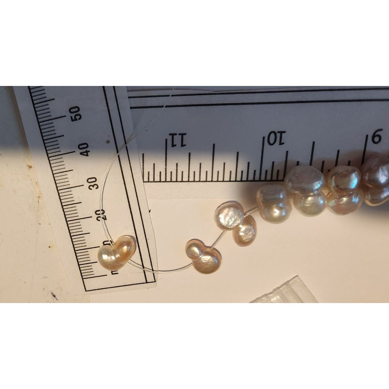 Pearls 32 Freshwater Cultured 10–12mm Baroque Pearl Strand, White 11 " Strand Middle hole Slight Pink tint