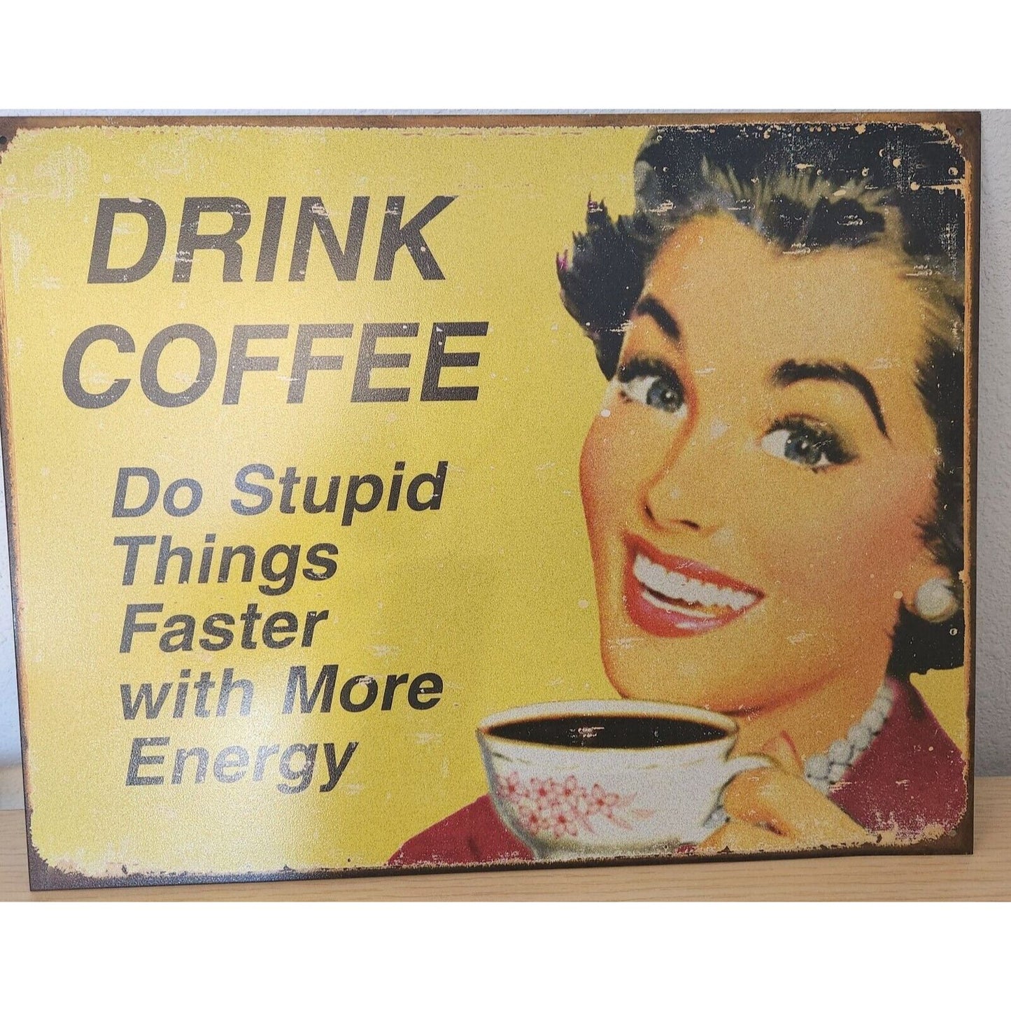 Metal Signs says " Drink Coffee Do Stupid Things Faster with More Energy"