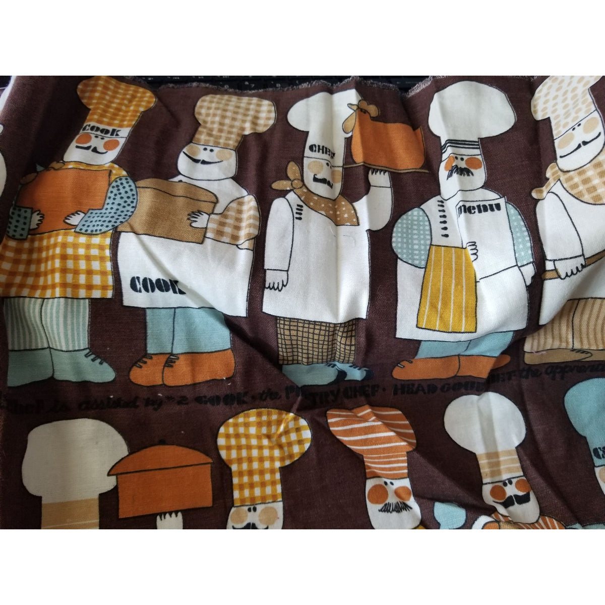 Material  Brown Bakers Chef Cake  44" x 19"    Cotton Craft Clothing Joann